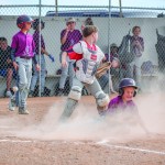 Rattler Tuck Neves slides safely into home in a game against Greybull. Stephanie Tolman