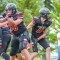 Husky Kysen Bullinger blocks for Carsten Schlenker as he passes the ball off in last week’s game in Burlington. Courtesy photo