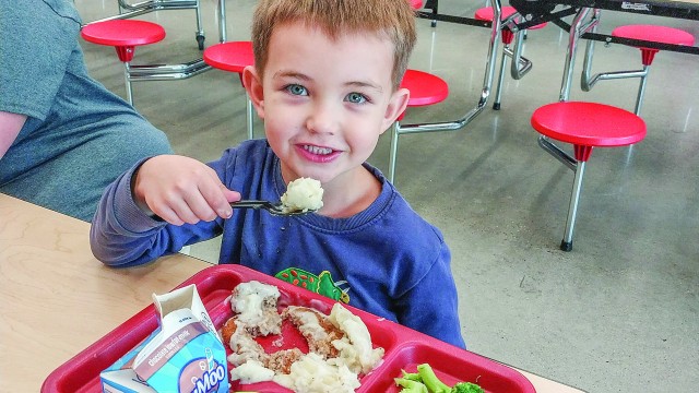 LIE preschooler Byrson Semin digs into the potatoes provided by U.W. ‘s Farm to School Program. The potatoes were donated by the Wyoming Hunger Initiative. Barbara Anne Greene