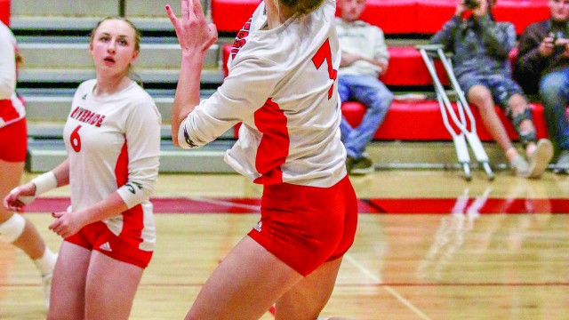 Cachelynn Forshee goes up to hit the ball back over the net on Friday against Burlington. Roxanne Petterson