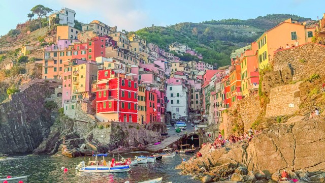 The pastel colored cliffside fishing village in the Cinque Terre Region of Liguria Italy. Madi Nelson