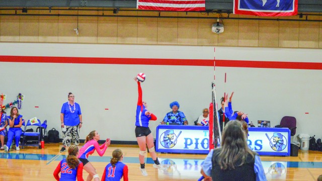 Tenly Zierlen spikes the ball at Ten Sleep’s homecoming game. The Ten Sleep/Riverside combo team won the match. Stephanie Olsen